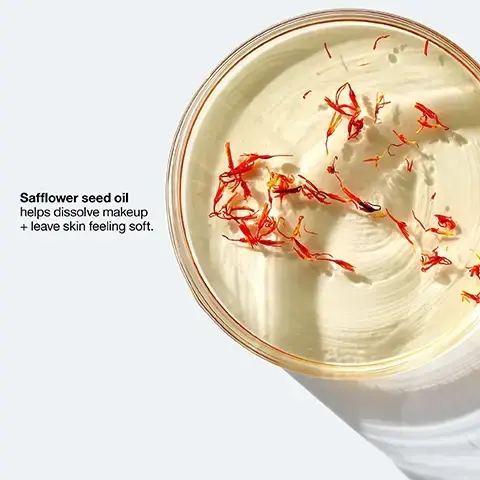 Image 1 - A clear container filled with creamy, light-colored product topped with red safflower petals, accompanied by the text Safflower seed oil helps dissolve makeup + leave skin feeling soft.
Image 2 - An abstract image of white cream textured against a light background with the text dissolve long-wearing makeup prominently displayed.
Image 3 - A close-up view of a glass container with a blurred liquid inside, next to a list of items marked with an X indicating they are free of fragrance, gluten, drying alcohol, sodium lauryl sulfate, and sodium laureth sulfate. Image 4 - Image of a Clinique skincare product display featuring a purple cleansing balm and a purple facial cleansing mousse alongside text that describes their benefits; visible text includes Our ultimate double cleanse, Take The Day Off. Every night, Step 1 Cleansing Balm Melts away tough face, eye, and lip makeup, SPF, and pollution, Step 2 Facial Cleansing Mousse Rinses away face makeup, dirt, oil and other impurities, and the Clinique logo.