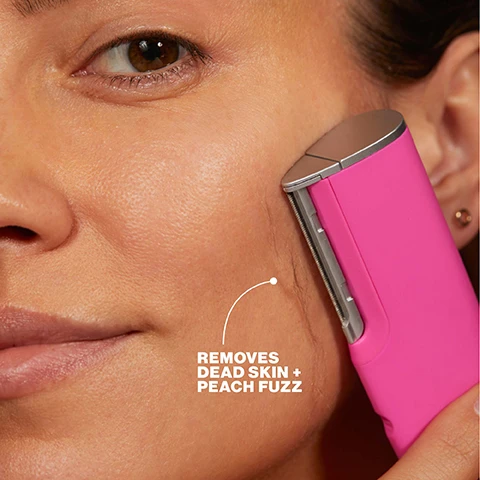 Image 1 - A close-up of a persons face shows a pink facial tool gently moving across their cheek to remove peach fuzz, with visible text that reads REMOVES DEAD SKIN + PEACH FUZZ. Image 2 - A close-up of a pink razor with a silver microfine blade edge, accompanied by text that reads: MICROFINE EDGE™ Ultimate precision, Closer contact with skin, Upgraded safety cage. Image 3 - A split image shows a womans face, with the left side labeled BEFORE depicting skin described as dull + fuzzy, and the right side labeled AFTER showing smoother, more defined skin described as smooth + defined. Image 4 - A split image shows a womans face with the left side labeled BEFORE displaying dull + fuzzy skin and visible facial hair, while the right side labeled AFTER shows smooth + glowing skin with reduced hair. Image 5 - A close-up of a persons face with brown skin, featuring their eye, cheek, and mouth, displaying text that reads: 100% saw instant improvement in skin texture* 97% had less visible fine lines + wrinkles** 94% showed improvement in discoloration + dark spots ** *Consumer panel survey using LUXE + 1x **Consumer panel survey after 4 weeks.