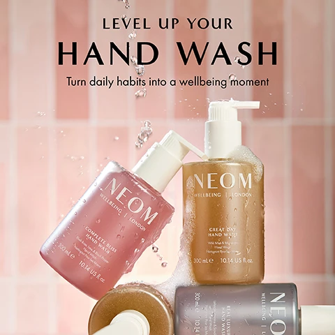 Image 1 - Image shows three NEOM hand wash bottles in pink, gold, and gray, with bubbles and water droplets on them, set against a pink tiled background; visible text reads LEVEL UP YOUR HAND WASH Turn daily habits into a wellbeing moment NEOM WELLBEING LONDON COMPLETE BLISS HAND WASH 300 mL 10.14 US fl oz GREAT DAY HAND WASH 300 mL 10.14 US fl oz REAL LUXURY HAND WASH 300 mL 10.14 US fl oz.
Image 2 - A bottle of NEOM Great Day Hand Wash with a white pump is shown on a warm, neutral background, accompanied by text that reads: FOR A GREAT DAY, Uplifting wild mint and mandarin, Blended with orange peel naturally rich in antioxidants, Natural colour from natural fragrance.
Image 3 - Two NEOM wellbeing products, a hand wash and a hand lotion, are displayed on a peach background, with the hand wash bottle bubbling and text reading 100% recyclable bottle designed to be refilled and reused and 100% natural fragrances that turn everyday moments into a wellbeing experience.
Image 4 - A hand holding a bottle of NEOM Great Day Hand Wash with visible bubbles, against a pink background, includes the text 86% AGREED THAT THEIR MOOD FELT INSTANTLY BOOSTED* and an asterisk noting an independent blind consumer study.