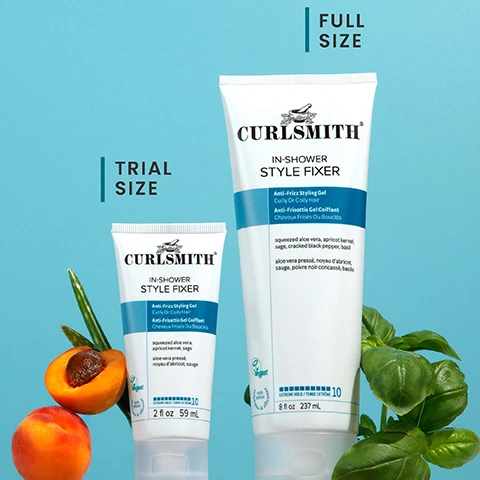 Image 1 - Two white tubes of Curlsmith In-Shower Style Fixer, one trial size and one full size, stand on a light blue background surrounded by sliced peaches, aloe vera, and basil leaves; the small tube reads TRIAL SIZE, CURLSMITH, IN-SHOWER STYLE FIXER, Anti-Frizz Styling Gel Curly Or Coily Hair, Anti-Frizzottis Gel Coiffant Cheveux Frisés Ou Bouclés, squeezed aloe vera apricot kernel sage, aloe vera pressé noyau dabricot sauge, Vegan, Extreme Hold 10, 2 fl oz 59 mL, and the large tube reads FULL SIZE, CURLSMITH, IN-SHOWER STYLE FIXER, Anti-Frizz Styling Gel Curly Or Coily Hair, Anti-Frizzottis Gel Coiffant Cheveux Frisés Ou Bouclés, squeezed aloe vera apricot kernel sage cracked black pepper basil, aloe vera pressé noyau dabricot sauge poivre noir concassé basilic, Vegan, EXTREME HOLD / TENUE EXTRÊME 10, 8 fl oz 237 mL. Image 2 - A white tube of Curlsmith In-Shower Style Fixer with ingredients apricot, aloe vera, and green leaves is shown against a blue background, surrounded by descriptive text: 10 Extreme hold, Long-lasting definition, No flaking or build-up, Locks in moisture & helps reduce frizz, Creates a cast, Weather resistant, Best for Medium & course textures. The tube itself reads: CURLSMITH IN-SHOWER STYLE FIXER, Anti-Frizz Styling Gel Curly Or Coily Hair, Anti-Frisottis Gel Coiffant Cheveux Frisés Ou Bouclés, squeezed aloe vera, apricot kernel, sage, cracked black pepper, basil, aloe vera pressée, noyau dabricot, sauge, poivre noir concassé, basilic, Vegan, 10 Extreme Hold / Tenue Extrême, 8 fl oz 237 mL. Image 3 - A comparison shows two tubes of Curlsmith In-Shower Style Fixer: the original 8fl oz / 237 mL tube with an orange label on the left, and the updated 8fl oz / 237 mL tube with a blue label and a SAME GREAT NEW LOOK PRODUCT badge on the right, both labeled as Anti-Frizz Styling Gel Curly Or Coily Hair with 10 Extreme Hold.